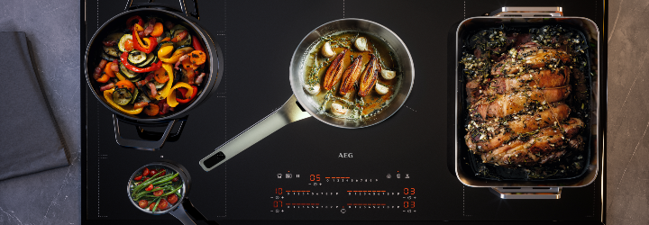 Cooking on an induction hob using different cooking zones using a variety of cookware 