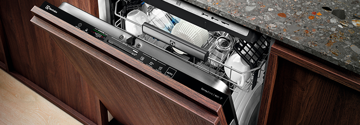 An Electrolux dishwasher fully loaded